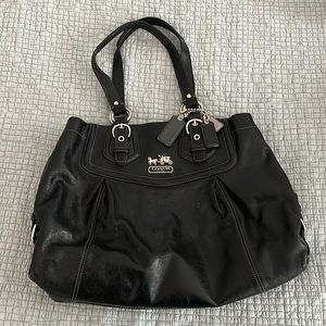 Vintage Coach, not outlet.